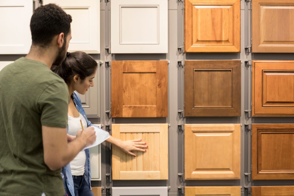 Young couple look at cabinet samples